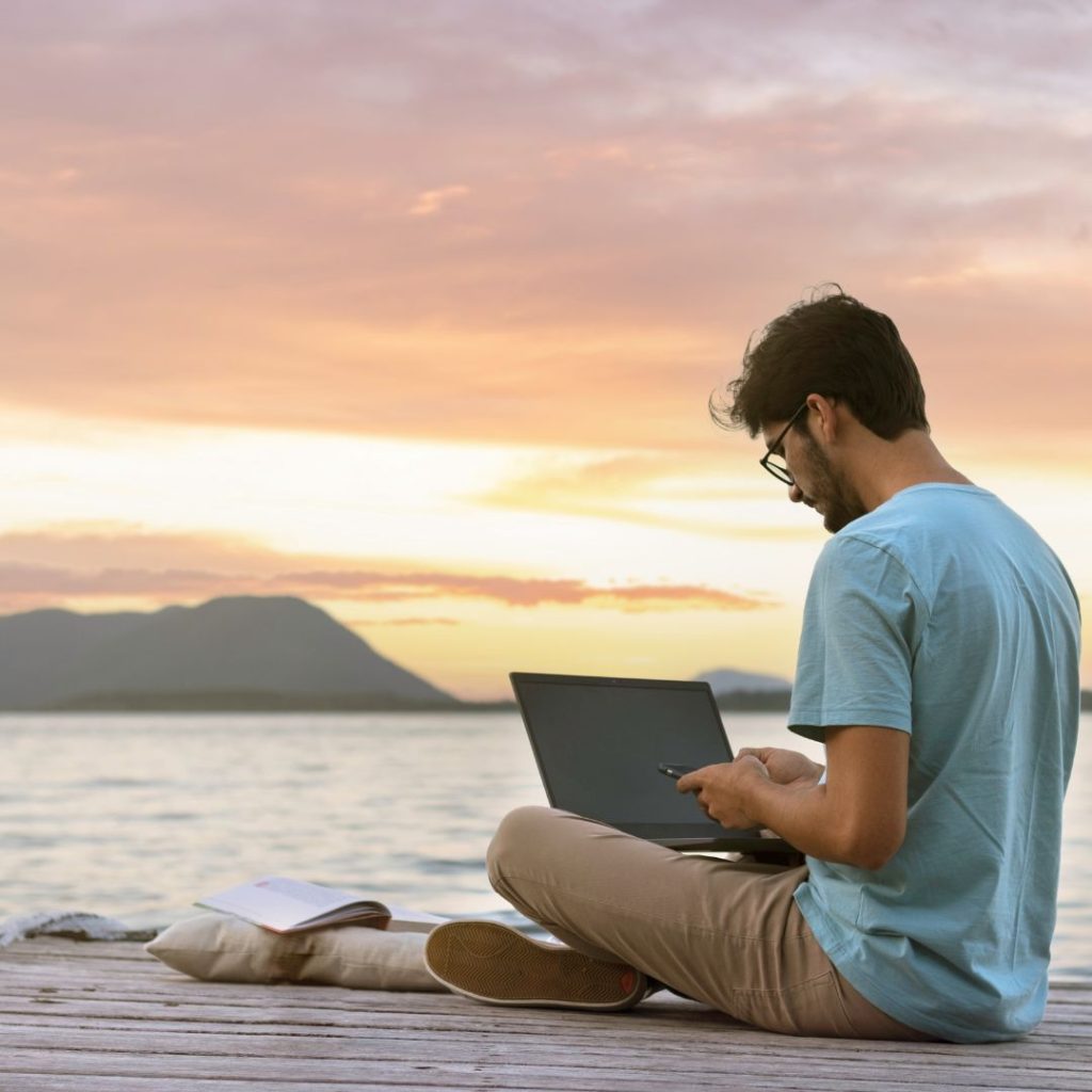 man in a foreign land with laptop